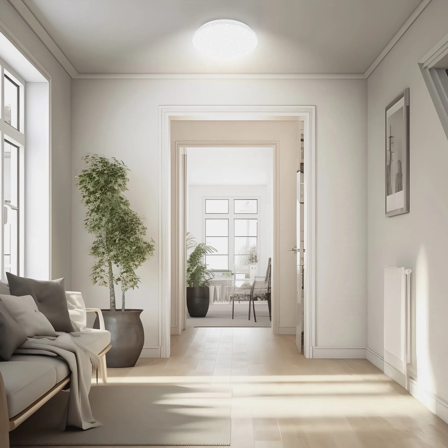 Biele okrúhle LED stropné svietidlo Brilo s efektom hviezdnej oblohy osvetľuje modernú chodbu. Biele okrúhle LED stropné svietidlo Brilo s efektom hviezdnej oblohy osvetľuje modernú chodbu.