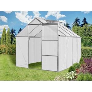 Skleník Floraworld Grow II so strešným oknom v záhrade.
