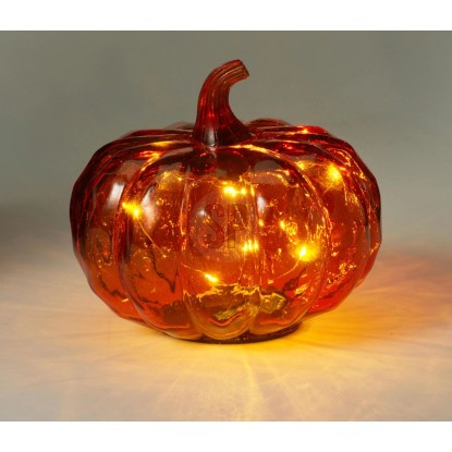 Dekoratívna oranžová sklenená lampa v tvare tekvice s LED, ideálna na jeseň a Halloween.