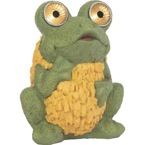 Zelené žabie solárne svetlo ako záhradná dekorácia so svietiacimi očami.