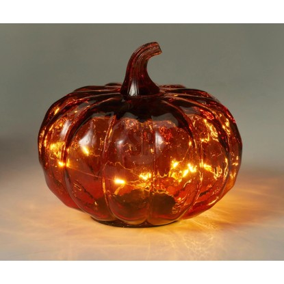 Oranžová sklenená tekvicová lampa so svietiacimi LED, ideálna na jesennú alebo halloweensku dekoráciu.