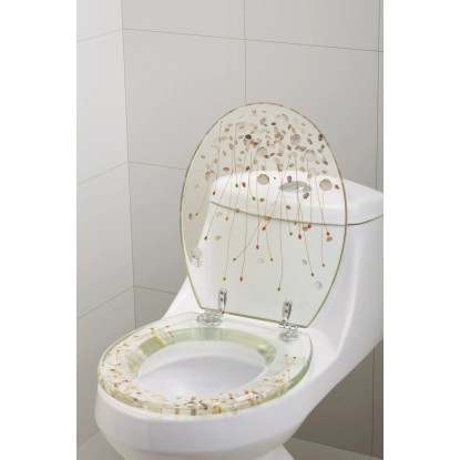 WC sedadlo Carduma s motívom mušlí a morskej trávy na bielej toalete.